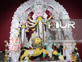 A Hindu Goddess Durga idol is inside the decoration of a puja pandal, a temporary structure set up during the Durga Puja festival in Kolkata...