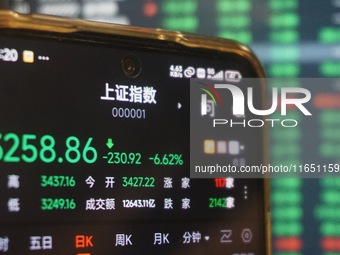 This is the day's stock index closing point displayed on the mobile phone of a citizen in Hangzhou, China, on October 9, 2024. (