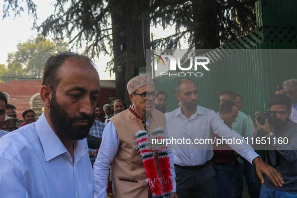 Jammu and Kashmir National Conference (JKNC) party leader Omar Abdullah (C) is greeted by supporters at his residence, a day after his victo...