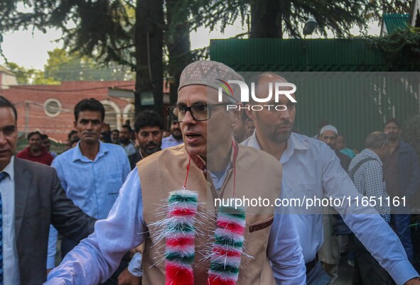 Jammu and Kashmir National Conference (JKNC) party leader Omar Abdullah (C) is greeted by supporters at his residence, a day after his victo...