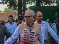 Jammu and Kashmir National Conference (JKNC) party leader Omar Abdullah (C) is greeted by supporters at his residence, a day after his victo...