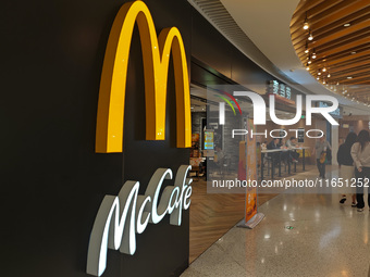 Customers eat at a McDonald's fast food restaurant in a shopping mall in the Huangpu district of Shanghai, China, on October 9, 2024. (