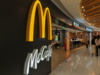 Customers eat at a McDonald's fast food restaurant in a shopping mall in the Huangpu district of Shanghai, China, on October 9, 2024. (