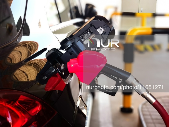 A vehicle fills up at a gas station in the Haidian district in Beijing, China, on October 9, 2024. 