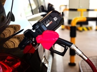 A vehicle fills up at a gas station in the Haidian district in Beijing, China, on October 9, 2024. (