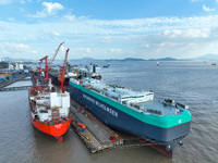 Workers at a ship maintenance company repair a ship in Zhoushan, China, on October 9, 2024. (