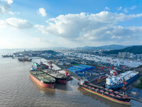 Workers at a ship maintenance company repair a ship in Zhoushan, China, on October 9, 2024. (