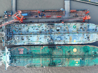 Workers at a ship maintenance company repair a ship in Zhoushan, China, on October 9, 2024. (