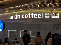 Customers shop at Luckin Coffee x Tea Mix store in Shanghai, China, on October 9, 2024. (