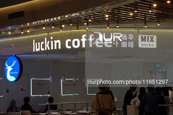 Customers shop at Luckin Coffee x Tea Mix store in Shanghai, China, on October 9, 2024. 