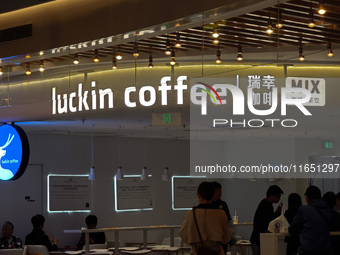 Customers shop at Luckin Coffee x Tea Mix store in Shanghai, China, on October 9, 2024. (