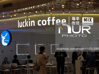 Customers shop at Luckin Coffee x Tea Mix store in Shanghai, China, on October 9, 2024. (