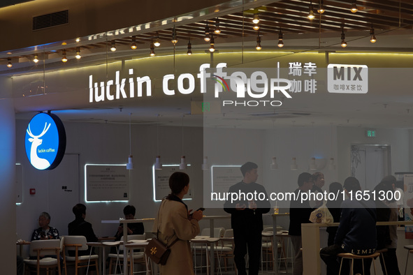 Customers shop at Luckin Coffee x Tea Mix store in Shanghai, China, on October 9, 2024. 