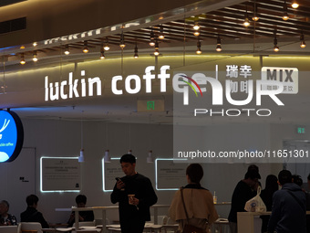 Customers shop at Luckin Coffee x Tea Mix store in Shanghai, China, on October 9, 2024. (