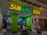 Customers shop at a SUBWAY store in Shanghai, China, on October 9, 2024. (