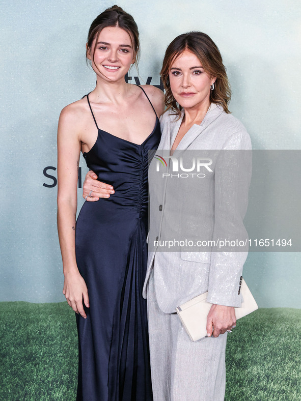 Charlotte Lawrence and mother Christa Miller arrive at the World Premiere Of Apple TV+ Series' 'Shrinking' Season 2 held at the Pacific Desi...