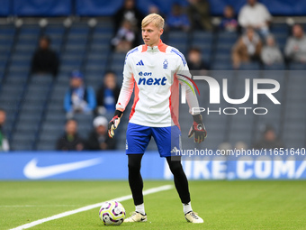 Aaron Bott of Nottingham Forest warms up ahead of kick-off during the Premier League match between Chelsea and Nottingham Forest at Stamford...