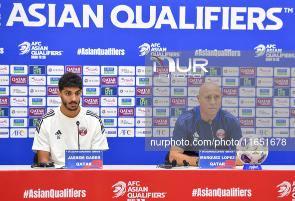 Qatar national team Head Coach Marquez Lopez (L) and player Jassim Jaber (R) attend a press conference at Al Thumama Stadium in Doha, Qatar,...