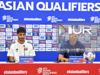 Qatar national team Head Coach Marquez Lopez (L) and player Jassim Jaber (R) attend a press conference at Al Thumama Stadium in Doha, Qatar,...