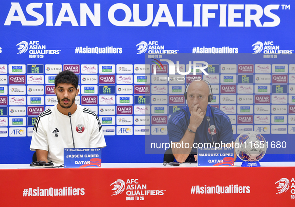 Qatar national team Head Coach Marquez Lopez (L) and player Jassim Jaber (R) attend a press conference at Al Thumama Stadium in Doha, Qatar,...