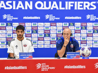 Qatar national team Head Coach Marquez Lopez (L) and player Jassim Jaber (R) attend a press conference at Al Thumama Stadium in Doha, Qatar,...