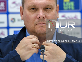 Kyrgyzstan National team Head Coach Maksim Lisitsyn attends a press conference at Al Thumama Stadium in Doha, Qatar, on October 9, 2024, ahe...