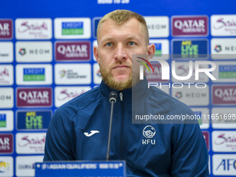 Kyrgyzstan National team player Valerii Kichin attends a press conference at Al Thumama Stadium in Doha, Qatar, on October 9, 2024, ahead of...