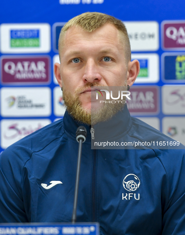 Kyrgyzstan National team player Valerii Kichin attends a press conference at Al Thumama Stadium in Doha, Qatar, on October 9, 2024, ahead of...