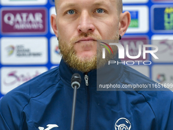 Kyrgyzstan National team player Valerii Kichin attends a press conference at Al Thumama Stadium in Doha, Qatar, on October 9, 2024, ahead of...