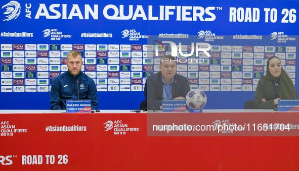 Kyrgyzstan National team Head Coach Maksim Lisitsyn (center) and player Valerii Kichin (right) attend a press conference at Al Thumama Stadi...