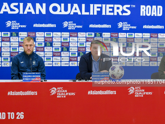 Kyrgyzstan National team Head Coach Maksim Lisitsyn (center) and player Valerii Kichin (right) attend a press conference at Al Thumama Stadi...