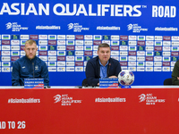 Kyrgyzstan National team Head Coach Maksim Lisitsyn (center) and player Valerii Kichin (right) attend a press conference at Al Thumama Stadi...