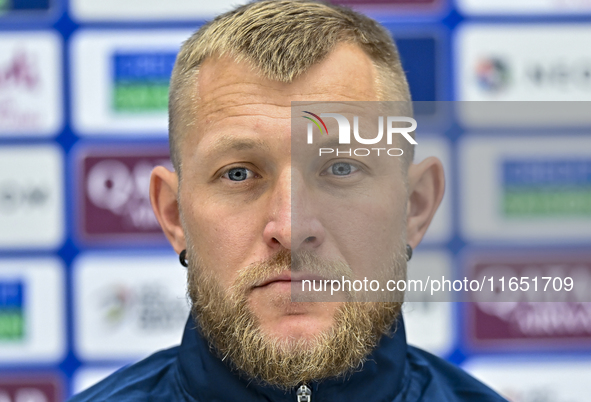 Kyrgyzstan National team player Valerii Kichin attends a press conference at Al Thumama Stadium in Doha, Qatar, on October 9, 2024, ahead of...