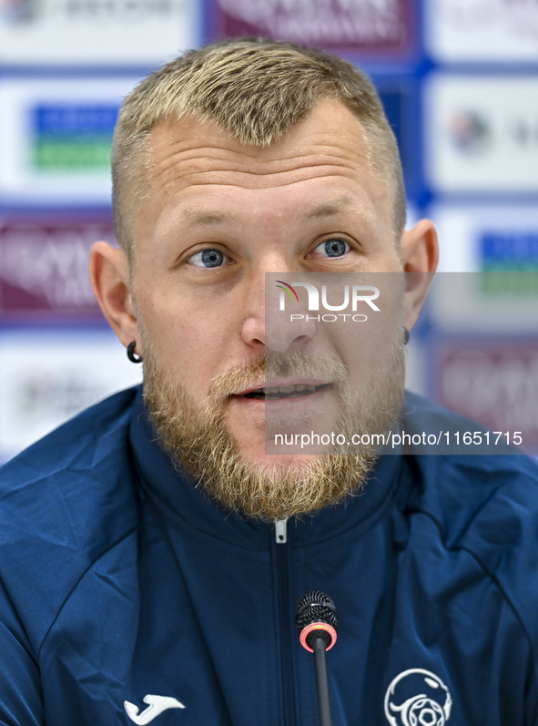 Kyrgyzstan National team player Valerii Kichin attends a press conference at Al Thumama Stadium in Doha, Qatar, on October 9, 2024, ahead of...