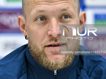 Kyrgyzstan National team player Valerii Kichin attends a press conference at Al Thumama Stadium in Doha, Qatar, on October 9, 2024, ahead of...