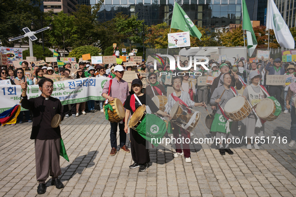 Hundreds of Catholic priests, nuns, and members of the Catholic Climate Action group march in central Seoul, starting from Myeongdong Cathed...