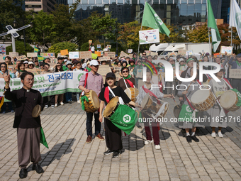 Hundreds of Catholic priests, nuns, and members of the Catholic Climate Action group march in central Seoul, starting from Myeongdong Cathed...