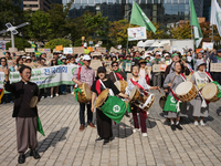 Hundreds of Catholic priests, nuns, and members of the Catholic Climate Action group march in central Seoul, starting from Myeongdong Cathed...