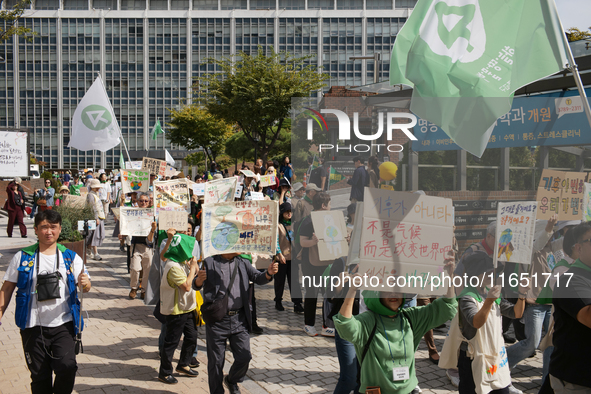 Hundreds of Catholic priests, nuns, and members of the Catholic Climate Action group march in central Seoul, starting from Myeongdong Cathed...