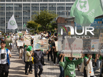 Hundreds of Catholic priests, nuns, and members of the Catholic Climate Action group march in central Seoul, starting from Myeongdong Cathed...