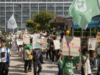 Hundreds of Catholic priests, nuns, and members of the Catholic Climate Action group march in central Seoul, starting from Myeongdong Cathed...