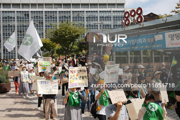 Hundreds of Catholic priests, nuns, and members of the Catholic Climate Action group march in central Seoul, starting from Myeongdong Cathed...