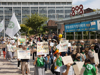 Hundreds of Catholic priests, nuns, and members of the Catholic Climate Action group march in central Seoul, starting from Myeongdong Cathed...