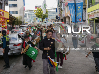 Hundreds of Catholic priests, nuns, and members of the Catholic Climate Action group march in central Seoul, starting from Myeongdong Cathed...