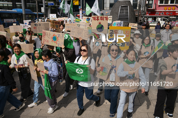 Hundreds of Catholic priests, nuns, and members of the Catholic Climate Action group march in central Seoul, starting from Myeongdong Cathed...