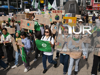 Hundreds of Catholic priests, nuns, and members of the Catholic Climate Action group march in central Seoul, starting from Myeongdong Cathed...