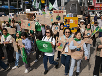 Hundreds of Catholic priests, nuns, and members of the Catholic Climate Action group march in central Seoul, starting from Myeongdong Cathed...