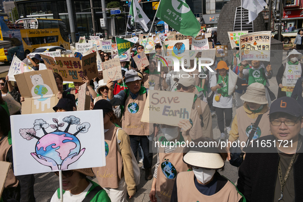 Hundreds of Catholic priests, nuns, and members of the Catholic Climate Action group march in central Seoul, starting from Myeongdong Cathed...