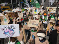 Hundreds of Catholic priests, nuns, and members of the Catholic Climate Action group march in central Seoul, starting from Myeongdong Cathed...