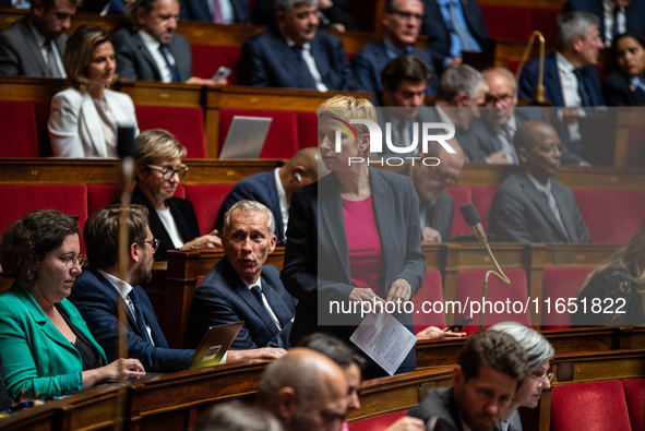 Clementine Autin, deputy of the Ecologists and Socialists group, sits among the benches of the General Assembly, the French Parliament, on t...